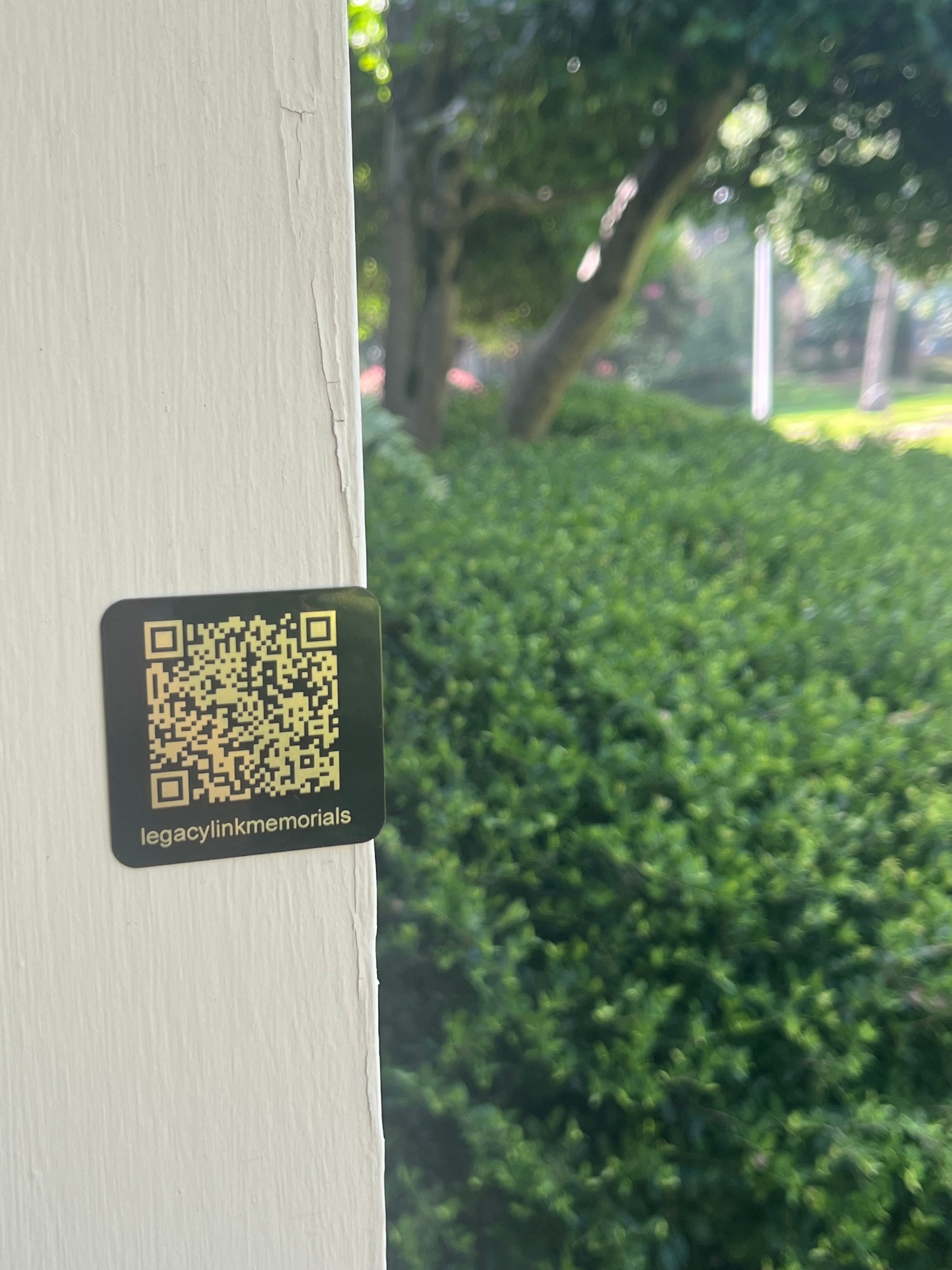 LegacyLink QR memorial plaque with gold engraving